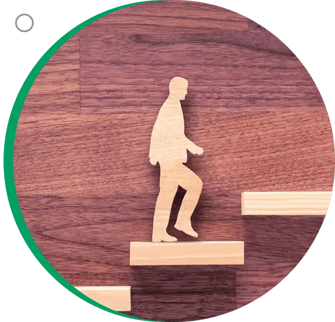 A wooden figure of a man walking up stairs.